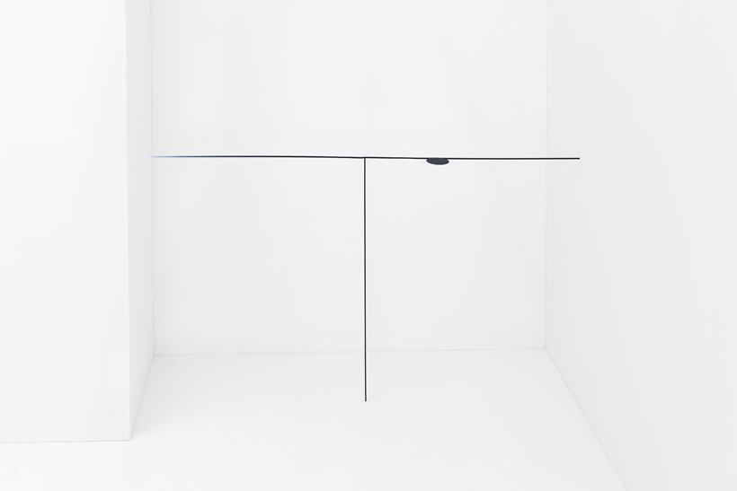 The minimalist table makes perfect use of this corner