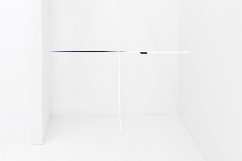 The minimalist table makes perfect use of this corner