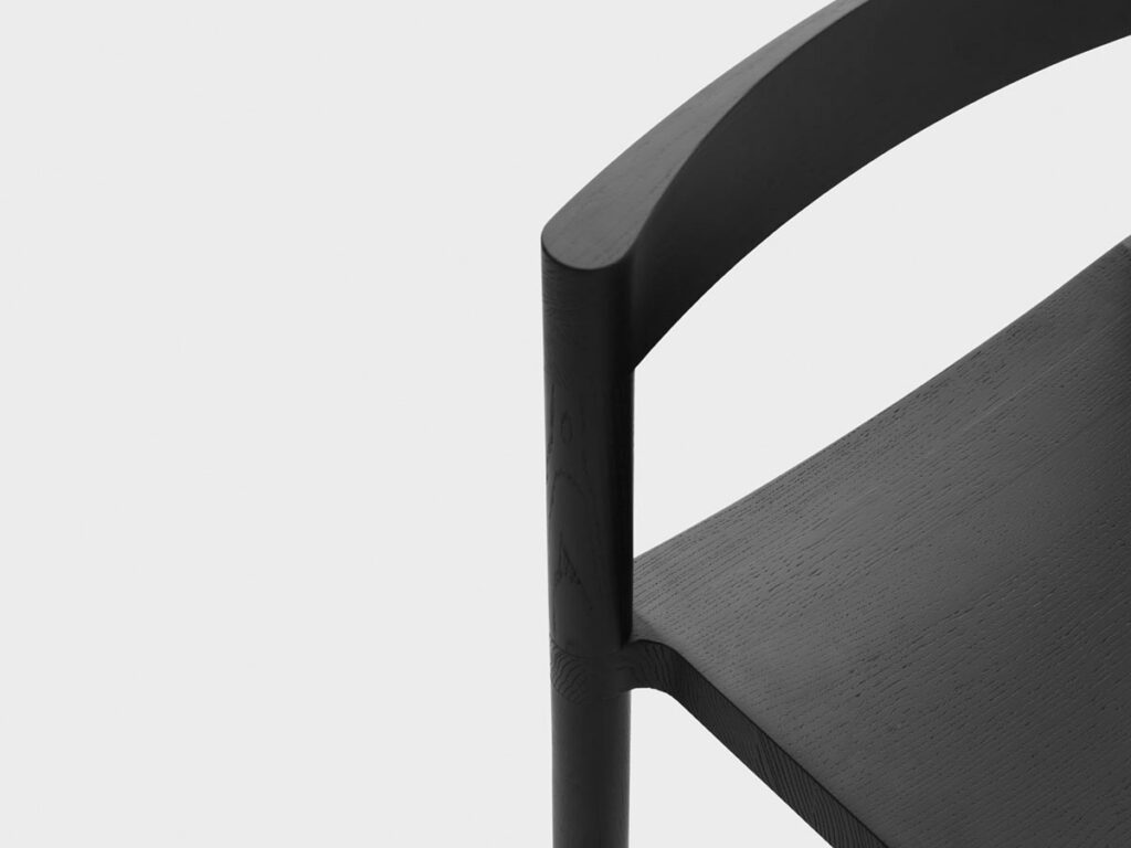 A detailshot of a black chair - Pier Chair designed by Léonard Kadid for resident.