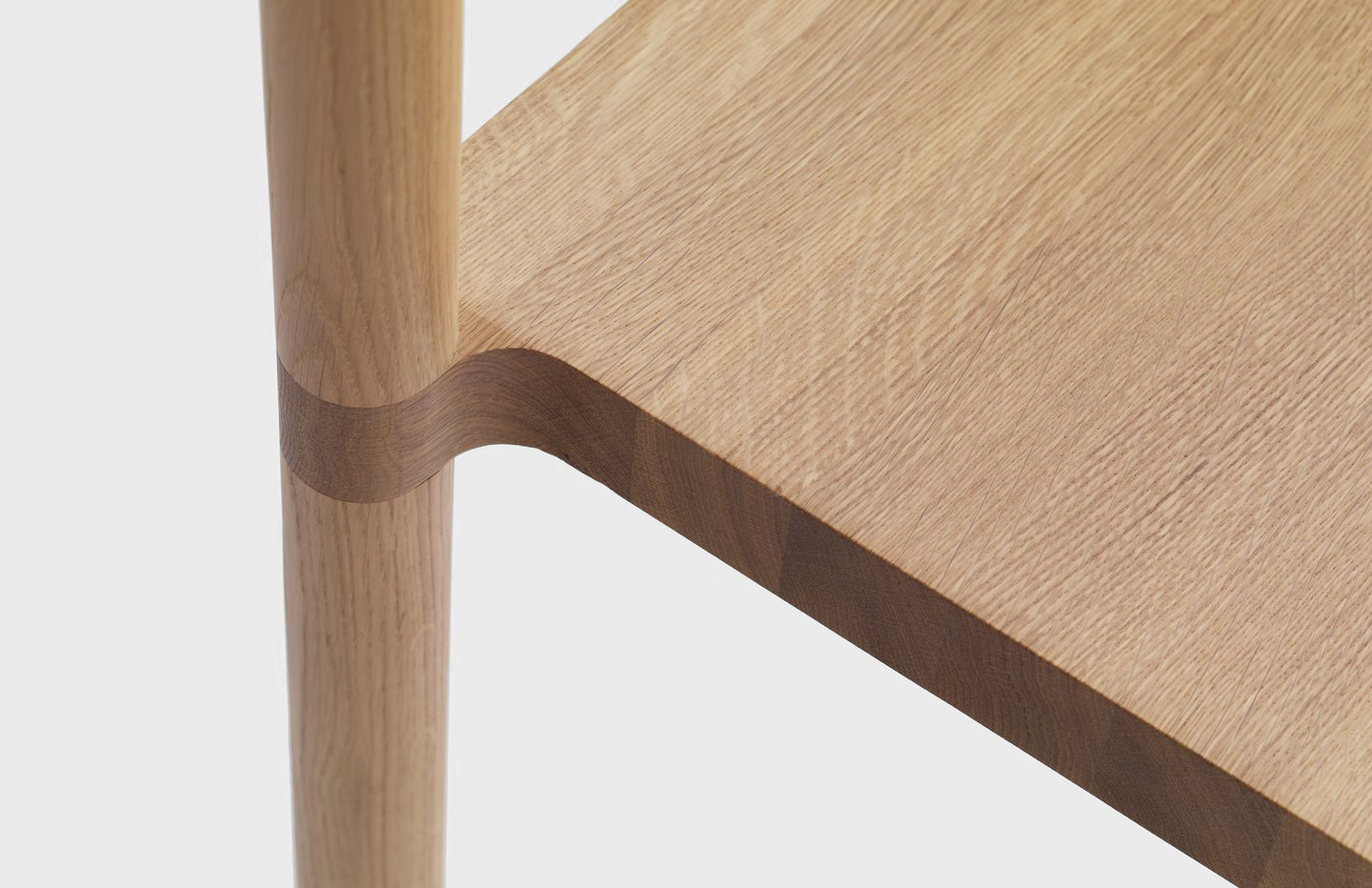 A detailshot of a chair made of oak - Pier Chair designed by Léonard Kadid for resident - Aesence