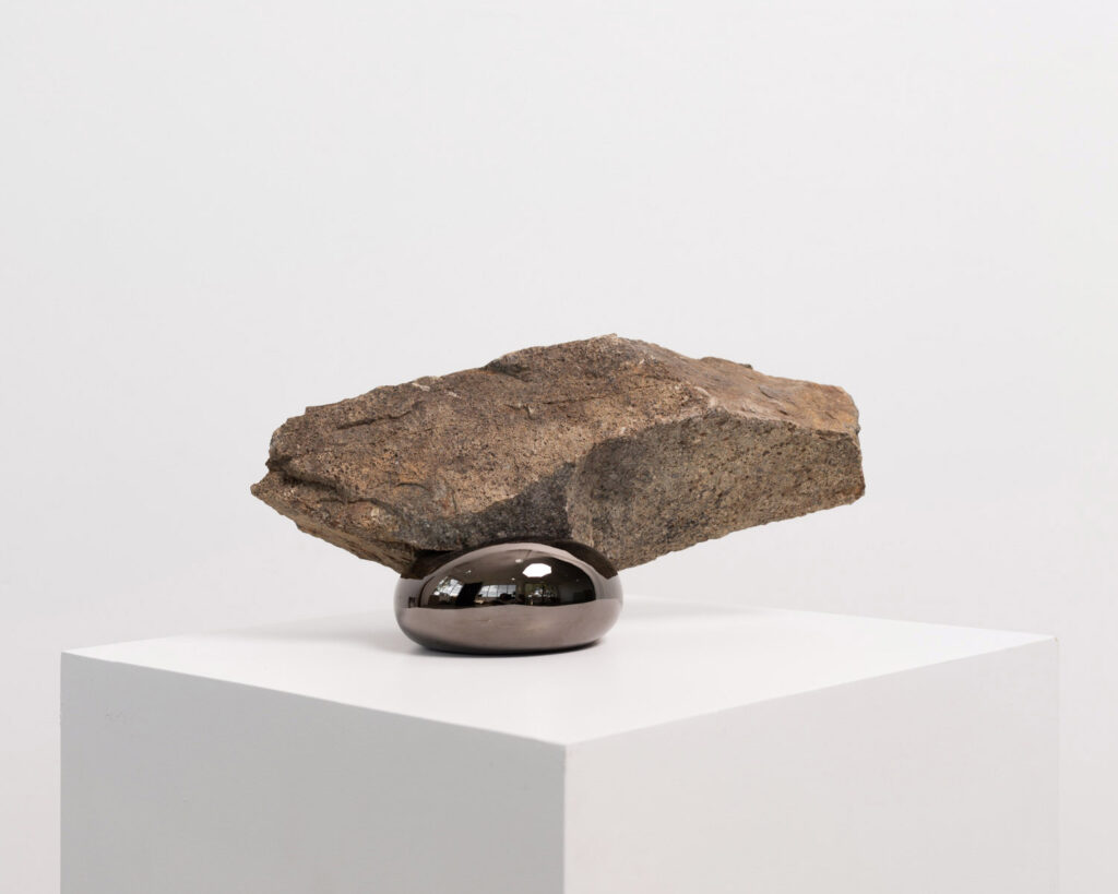 Morgan Stokes, Simulation Sculpture 9, 2023, Basalt and cast aluminium with black nickel plating, 17 x 32 x 13 cm